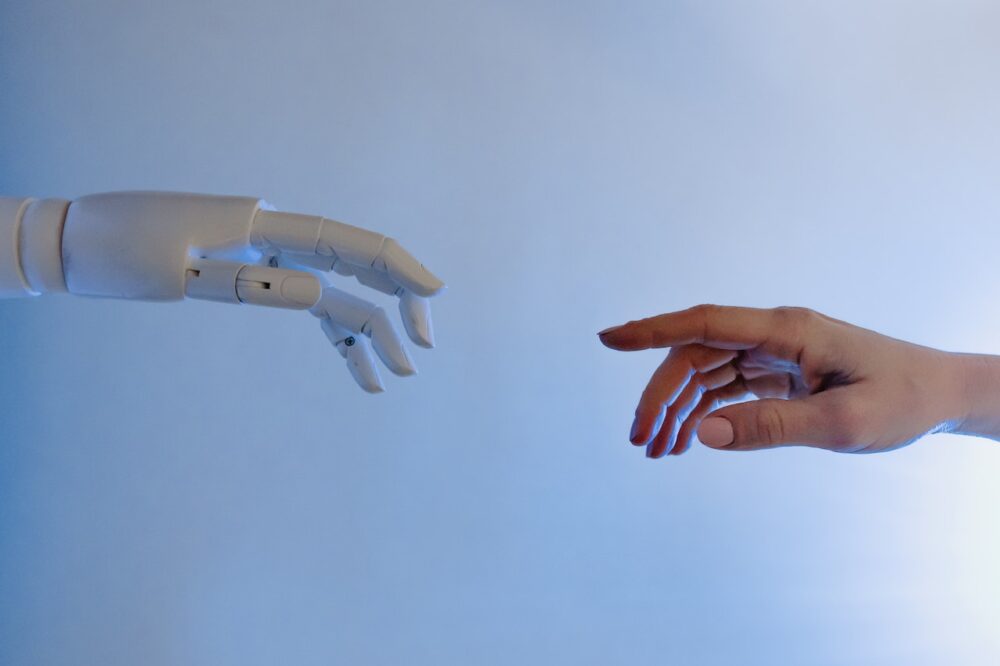 Hands of human and bot